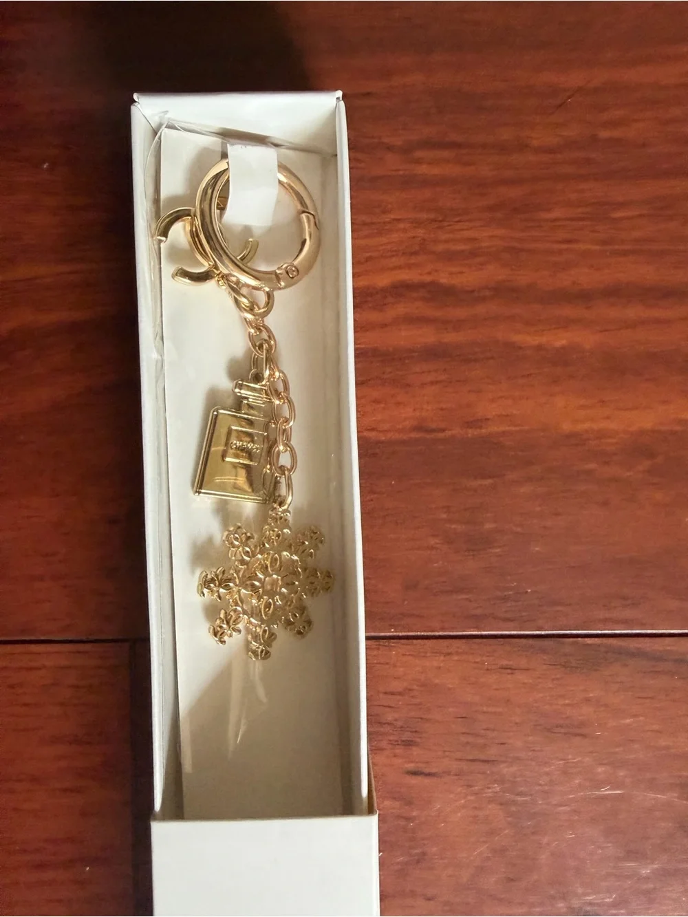 CHANEL Gold Snowflake and Bag Charm Key Ring
